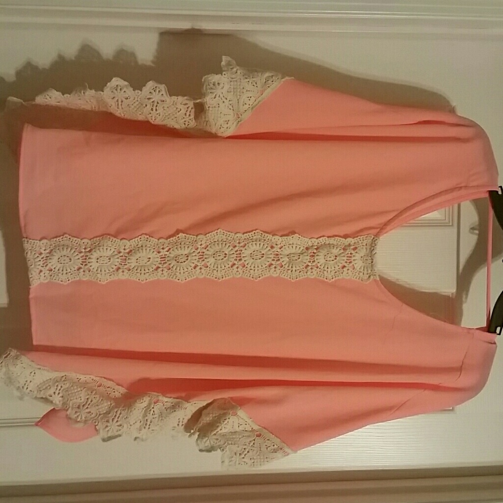 Peach blouse with white lace detail